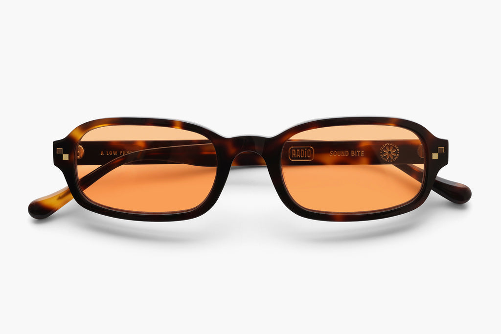 orange lens sunglasses sound bite sunglasses – a modern twist on 2000's nostalgia with vibrant y2k design elements. unisex, handcrafted cellulose acetate frame, and high-quality nylon lenses for uv protection.